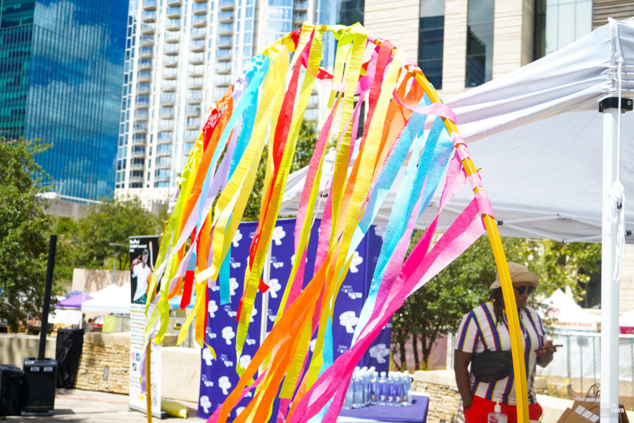 let's eat cake and celebrate event presented by the downtown austin alliance foundation. birthday bash streamers backdrop