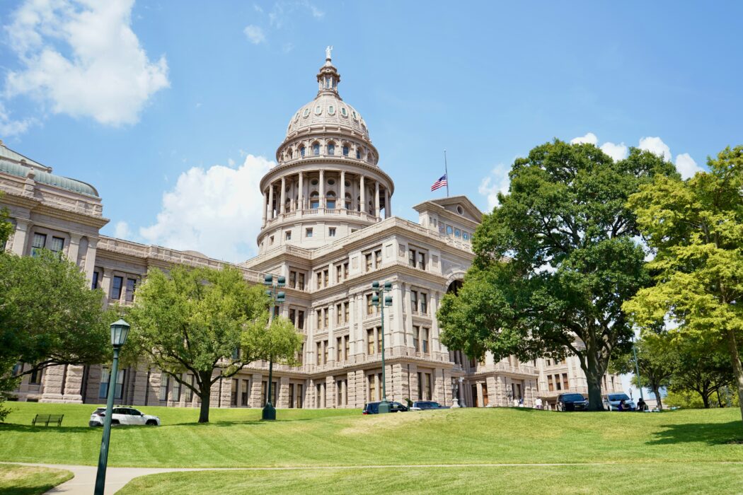 photo of the texas state capitol on a clear sunny day in downtown austin, tx