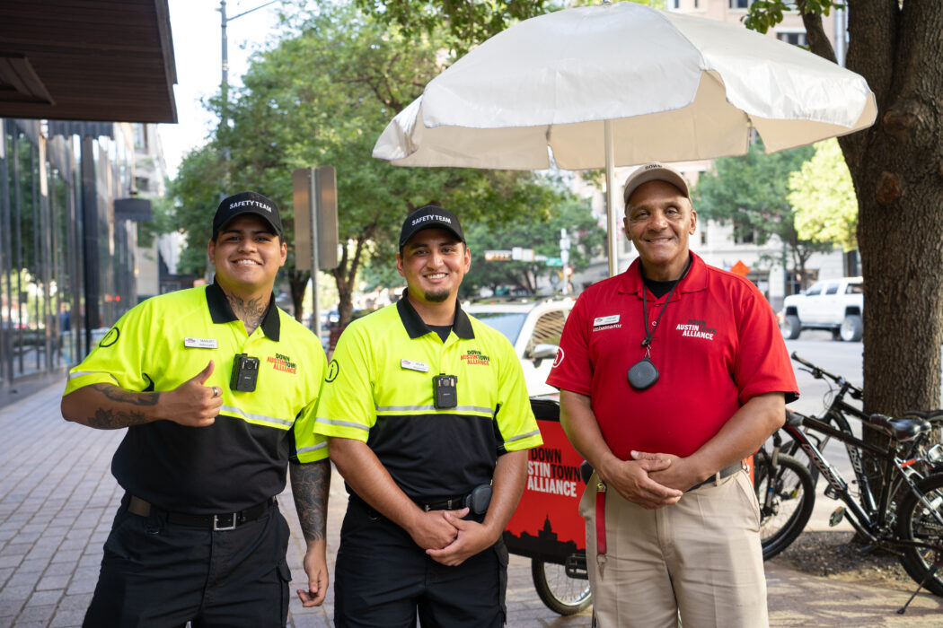 downtown ambassador safety team from the downtown austin alliance yellow shirt