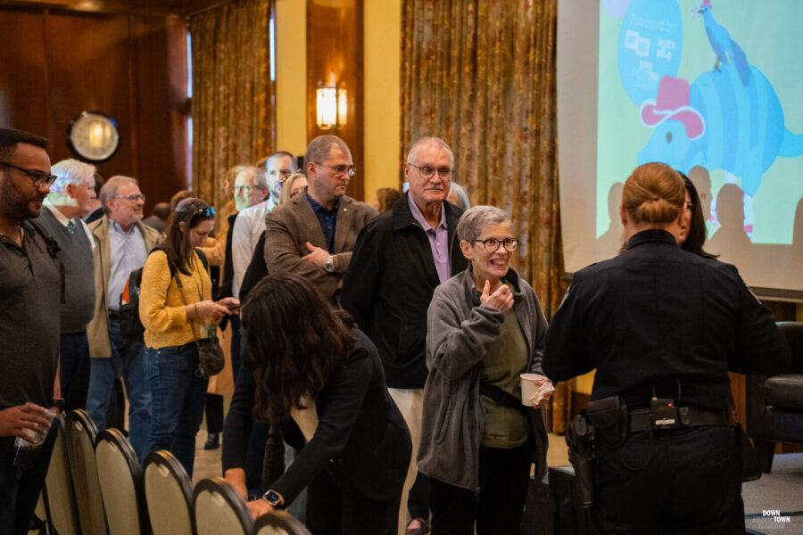 Attendees line up to meet APD Chief Davis after the event